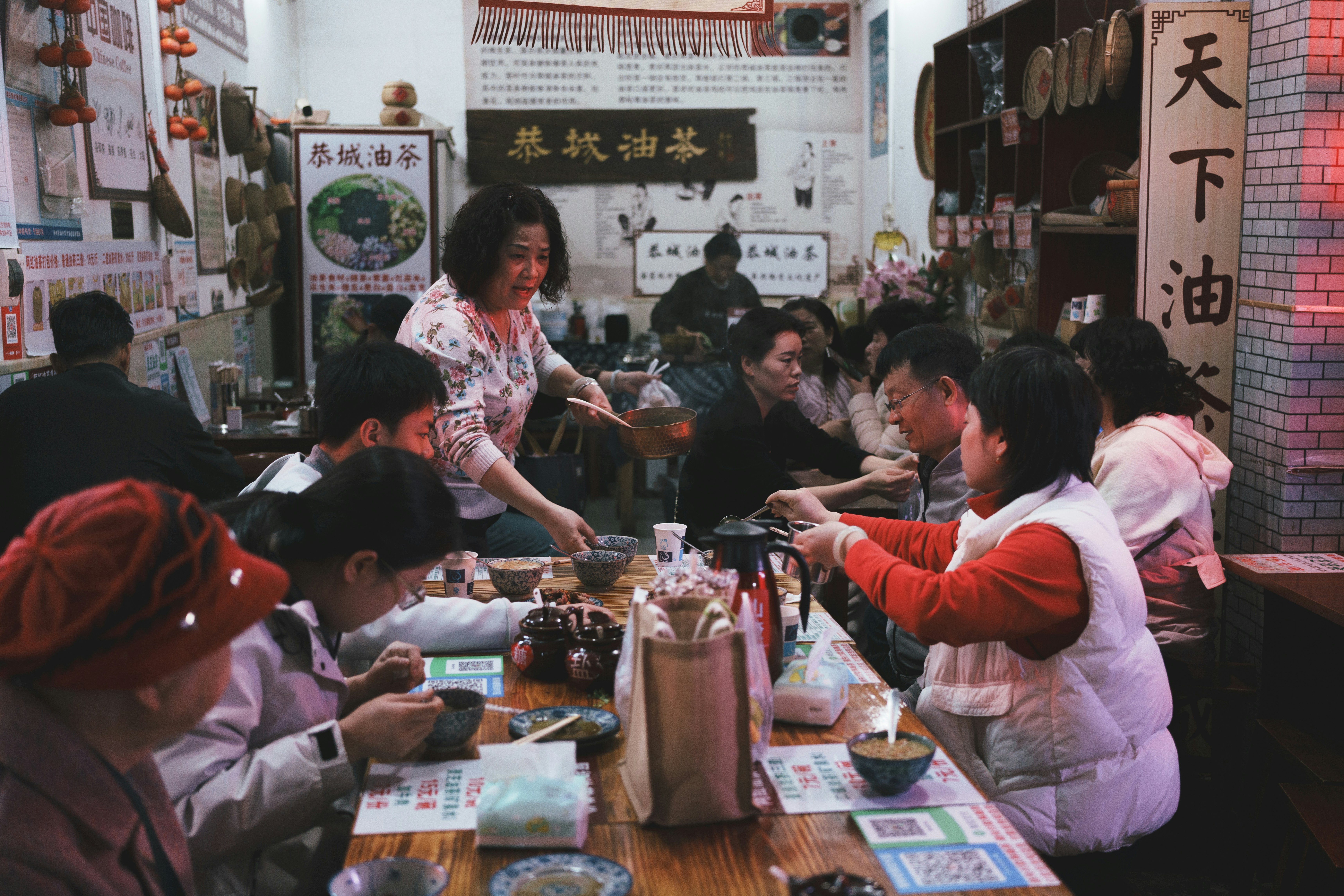 Scanning a WeChat Pay QR code at a Chinese restaurant — the standard way to pay for everything from street food to hotels.