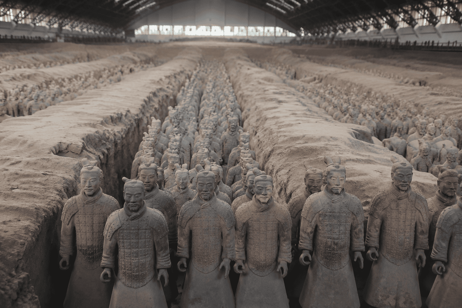 Rows of life-sized Terracotta Warriors standing in Pit 1 in Xi'an, China