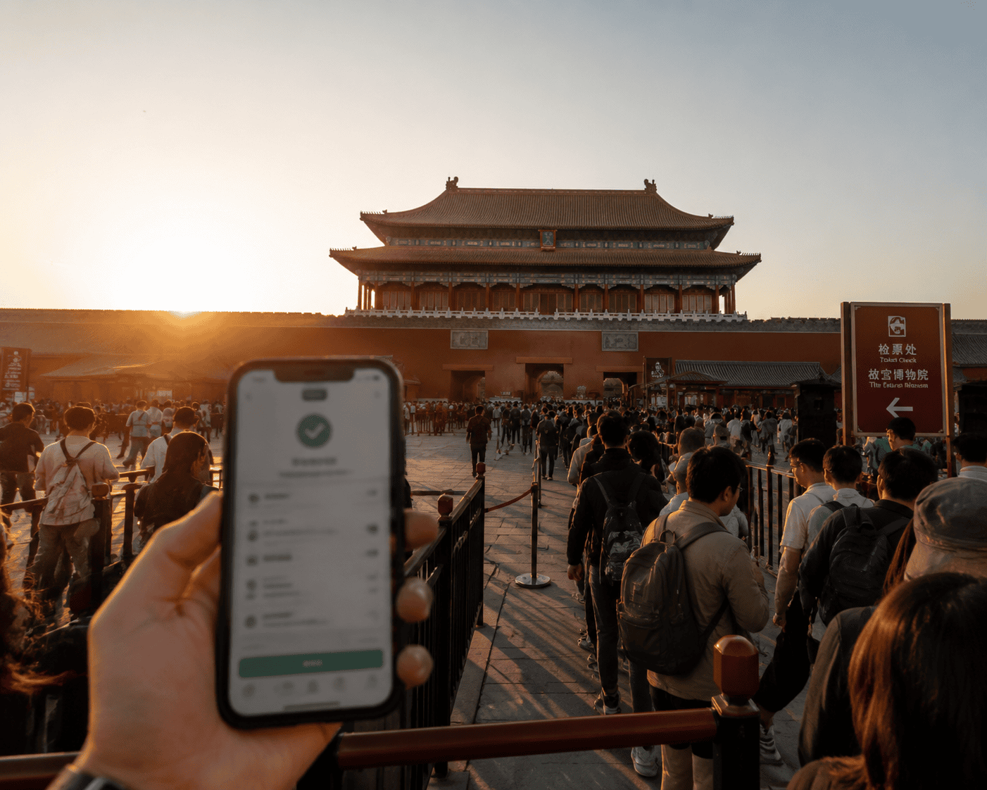 Forbidden City entrance with tourists and booking confirmation on phone